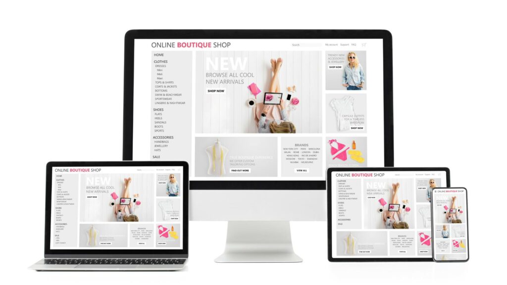 A desktop, laptop, tablet, and phone are displaying the same web design for an online boutique shop.