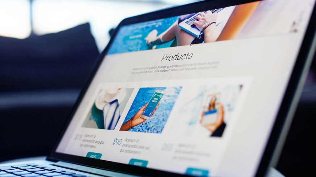 A laptop is displayed with a Products page on the screen, demonstrating great user experience in web design.