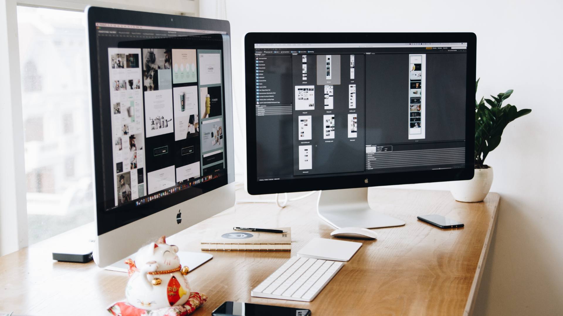 UI/UX design is displayed on two desktop computer monitors.