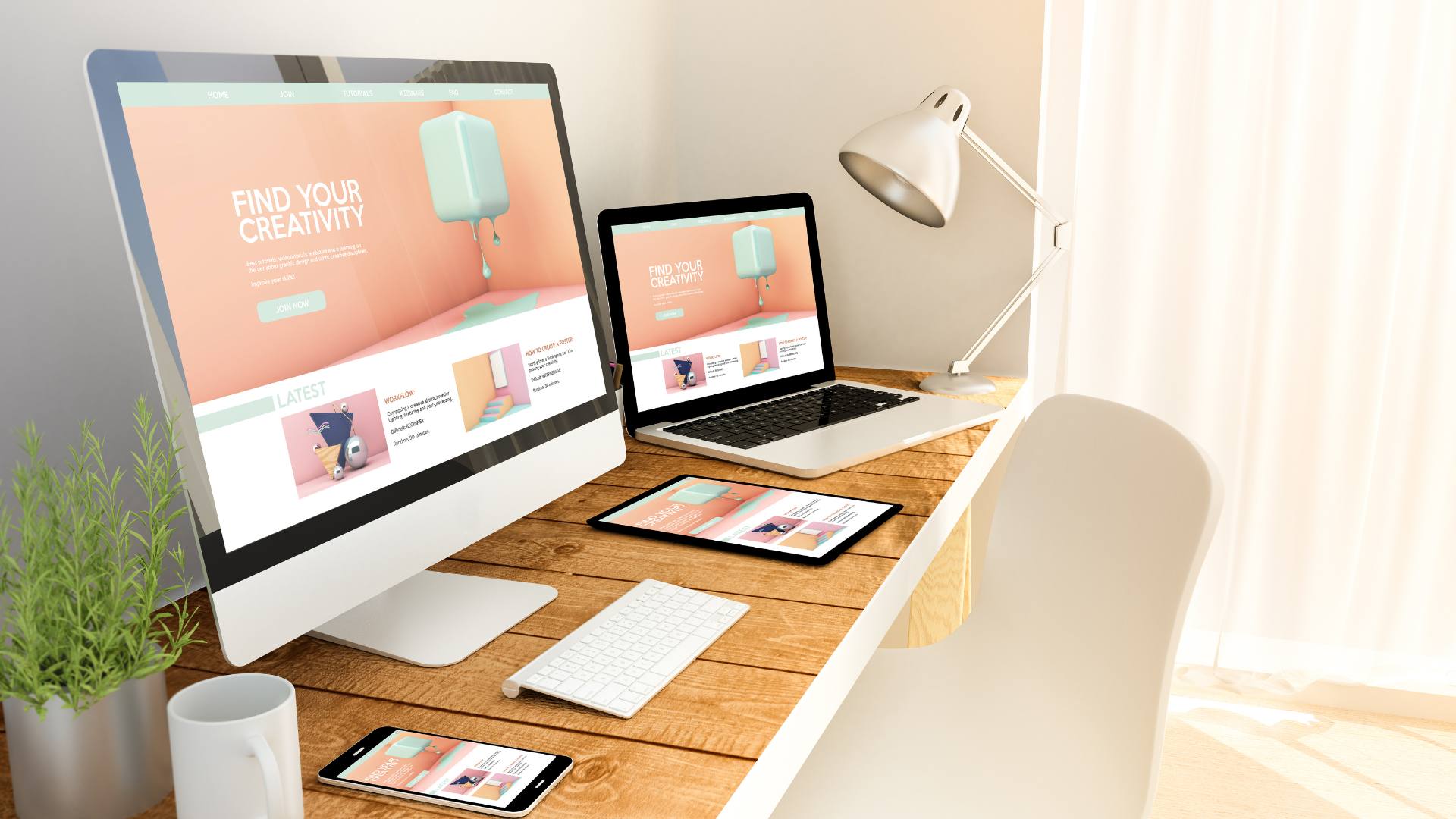 UI/UX design is displayed on a desktop, laptop, tablet, and phone on a wooden desk.