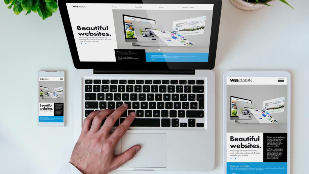 A laptop, tablet, and phone are displaying the same web design, demonstrating responsive tips and designs.