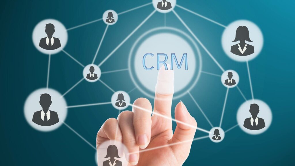 The word CRM is displayed in a gray web graphic, demonstrating crm implementation.